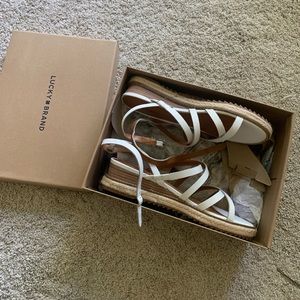 white strap up sandals